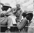 "... troops in Burma stop work briefly to read President Truman's Proclamation of Victory in Europe." - NARA - 531341.jpg