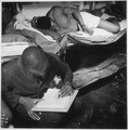 "... sailors in their bunkroom aboard the U.S.S. Ticonderoga (CV-14) on eve of the Battle of Manila, PI. Thomas L. Crens - NARA - 520867.tif